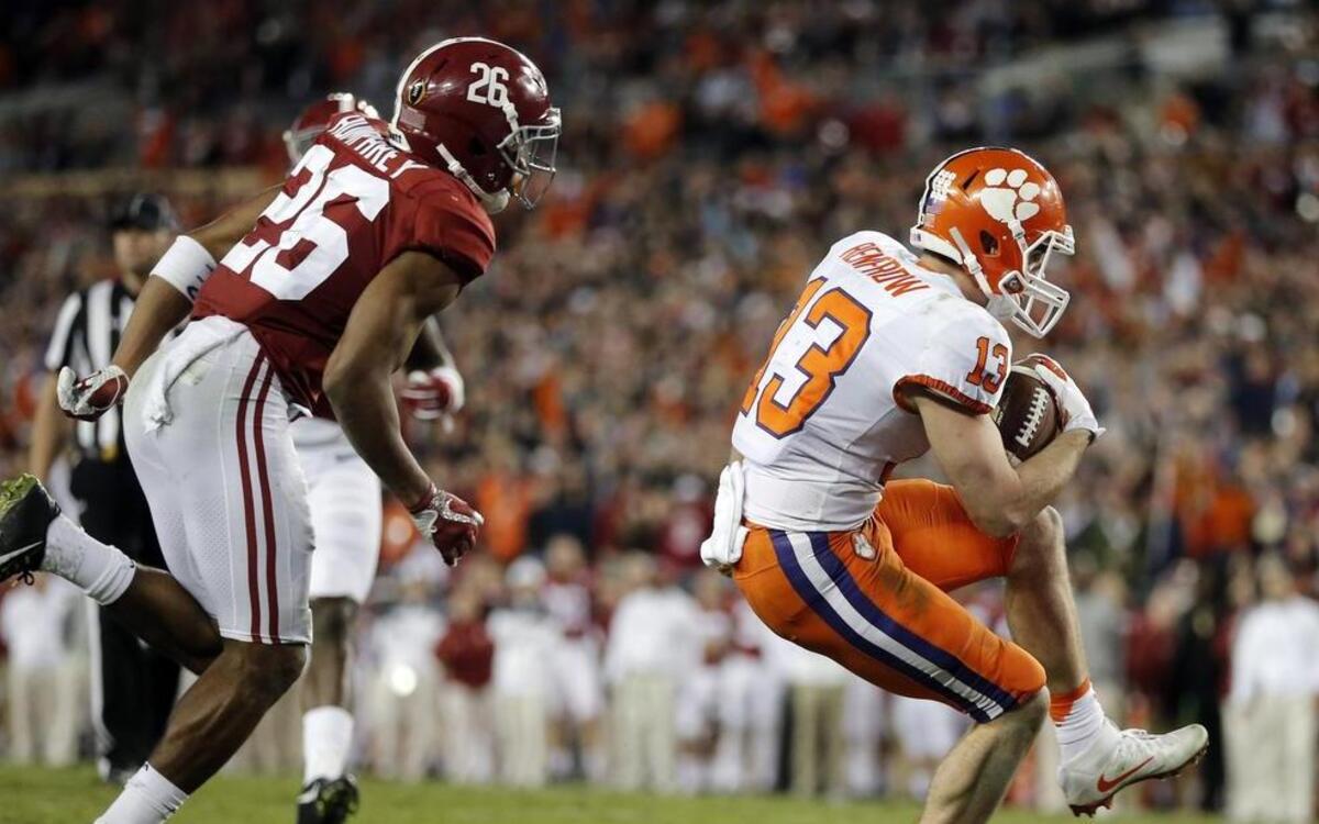 Clemson’s Hunter Renfrow (right) scored the winning touchdown against Alabama on Monday night.