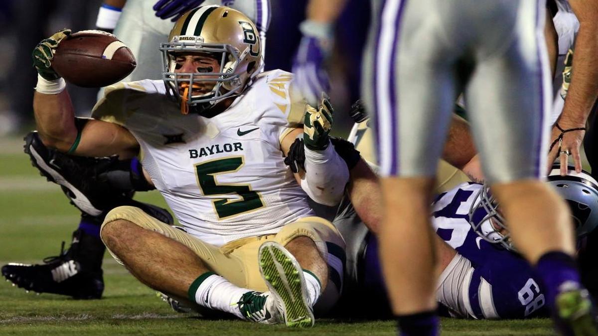 Baylor linebacker Grant Campbell came up with the ball after a Kansas State fumble Thursday the first half of their game in Manhattan, Kan.
