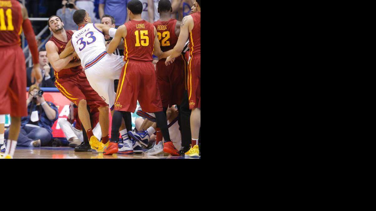 
Kansas forward Landen Lucas and Iowa State forward Georges Niang get tied up fighting for a jump ball during the first half on Monday night at Allen Fieldhouse. 
