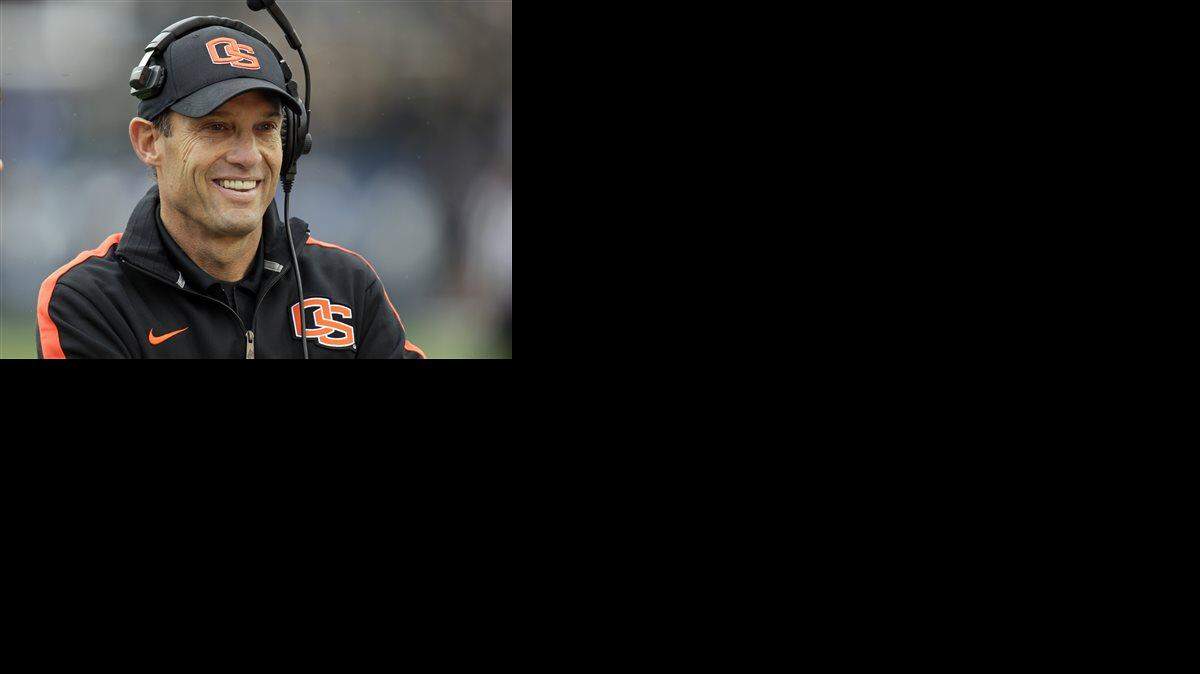 FILE - In this Oct. 13, 2012, file photo, Oregon State head coach Mike Riley smiles before the start of an NCAA college football game against BYU in Provo, Utah. Nebraska has hired Riley as its new football coach on Thursday, Dec. 4, 2014, replacing the fired Bo Pelini.