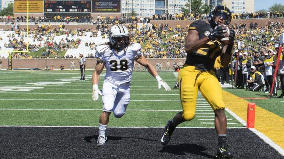 
Missouri Tigers wide receiver Bud Sasser caught catches a touchdown pass against Central Florida defensive back Jordan Ozerities.
