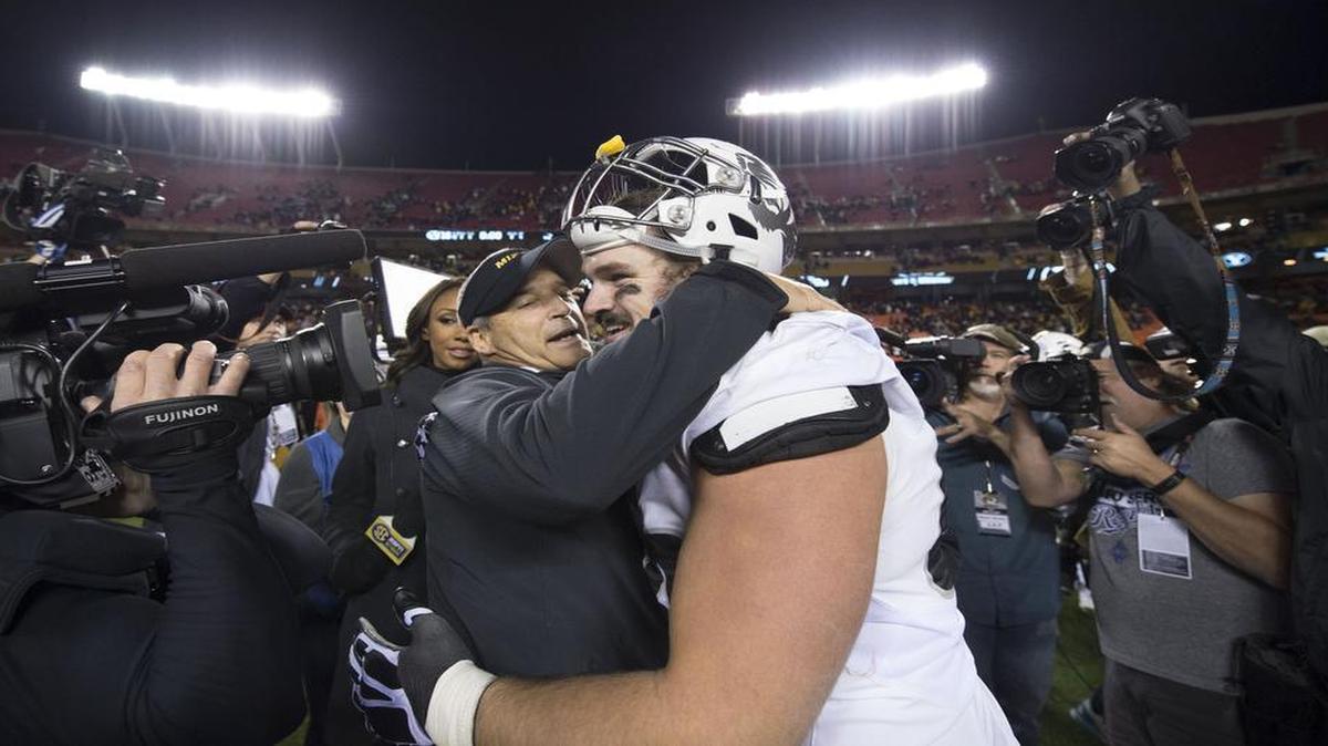 Missouri coach Gary Pinkel shared a hug with offensive lineman Connor McGovern after the Tigers beat Brigham Young 20-16 at Arrowhead Stadium last week.