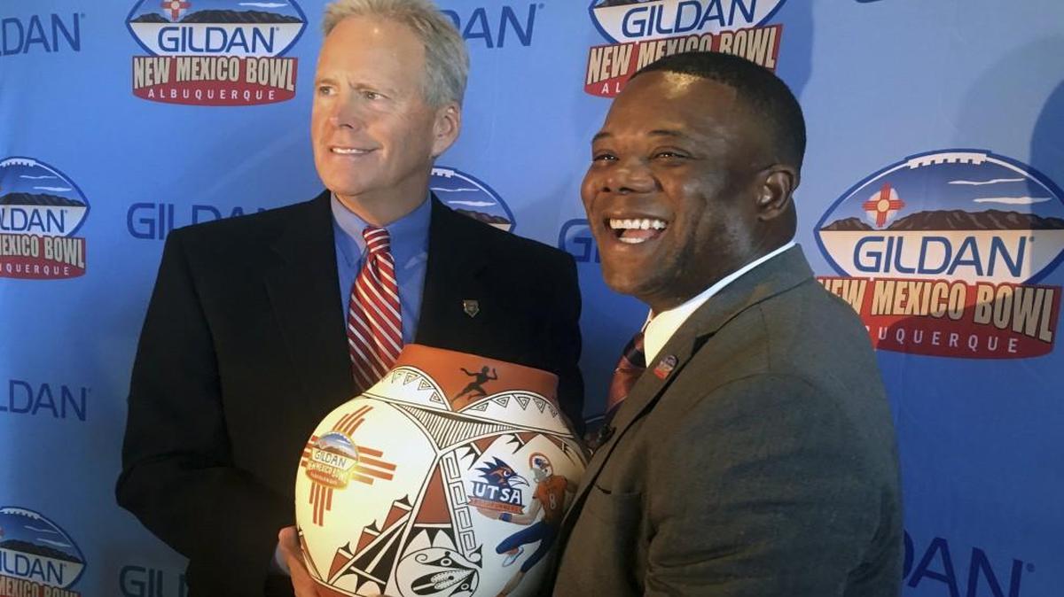 New Mexico head coach Bob Davie (left) and Texas-San Antonio head coach Frank Wilson posed for a photo at a news conference in Albuquerque, N.M. on Wednesday about playing in the upcoming New Mexico Bowl.