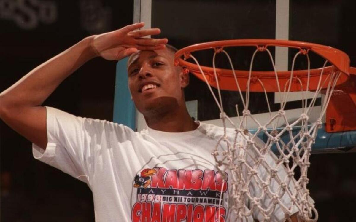 Paul Pierce (top) saluted his team’s 1998 Big 12 tournament title.