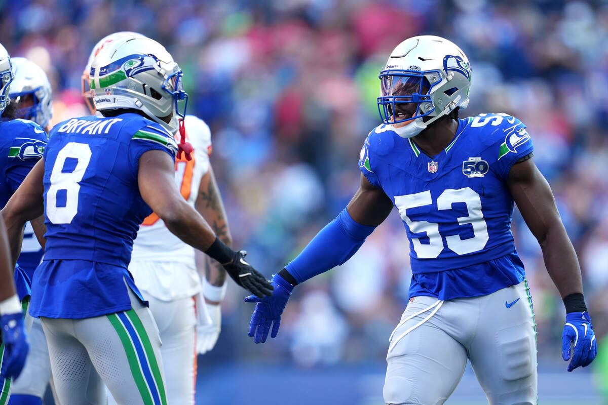 Boye Mafe (right) and Coby Bryant of the Seattle Seahawks react against the Tampa Bay Buccaneers at Lumen Field on Oct. 5, 2025 in Seattle, Washington.