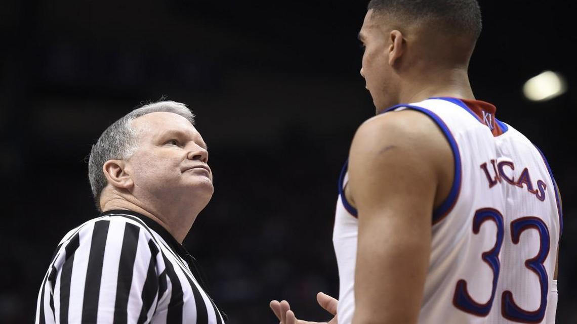 No, KU’s Landen Lucas is not talking with one of his coaches.