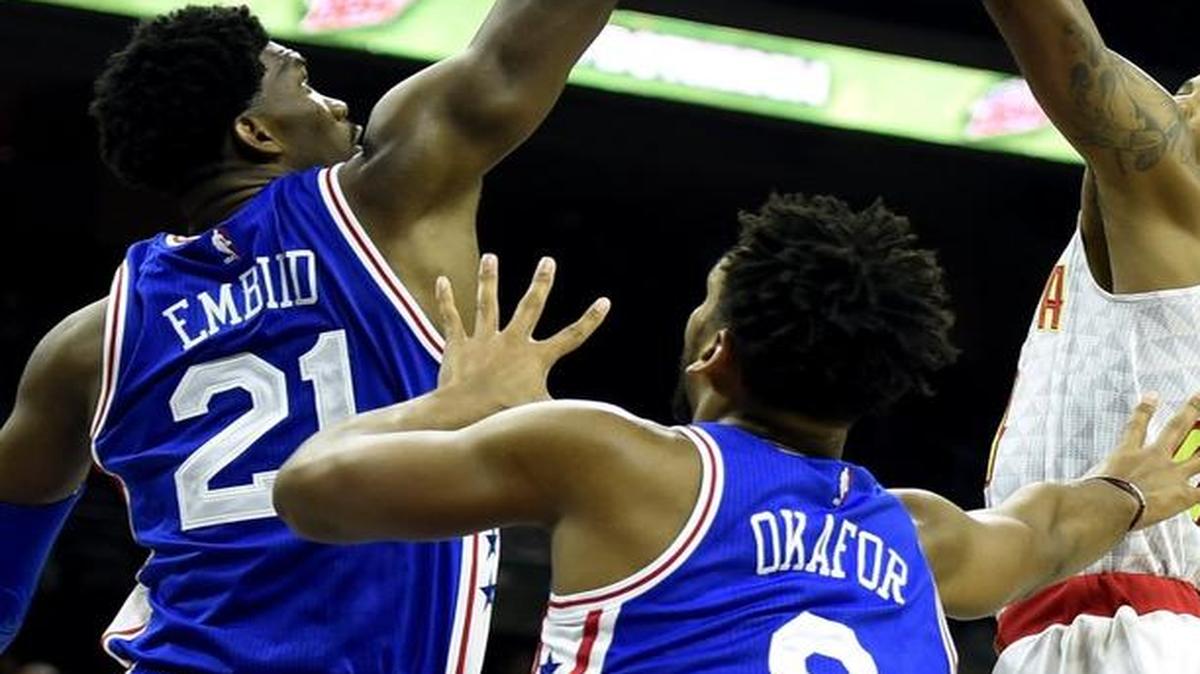 Atlanta’s Kent Bazemore took a shot over Philadelphia 76ers’ Joel Embiid and Jahlil Okafor during a game last month.