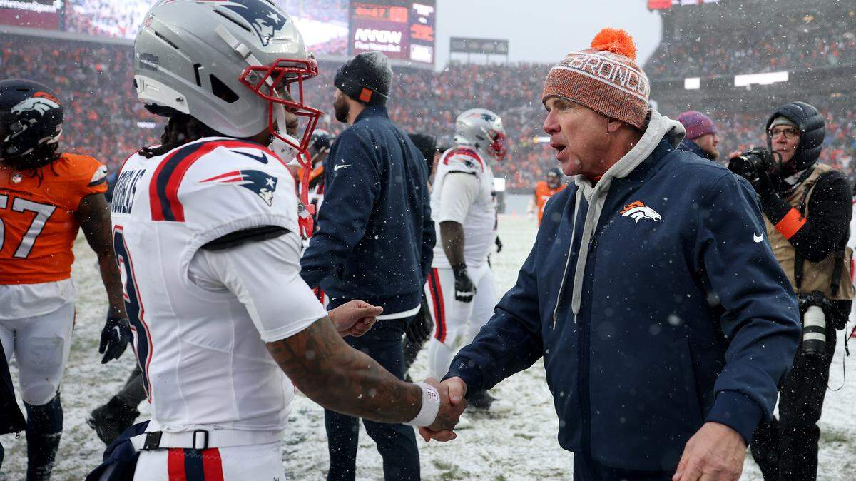 Denver Broncos head coach Sean Payton of the Denver Broncos and DeMario Douglas of the New England Patriots shake hands following the AFC Championship Game at Empower Field At Mile High on Jan. 25, 2026 in Denver, Colorado. The New England Patriots defeat the Denver Broncos 10-7.