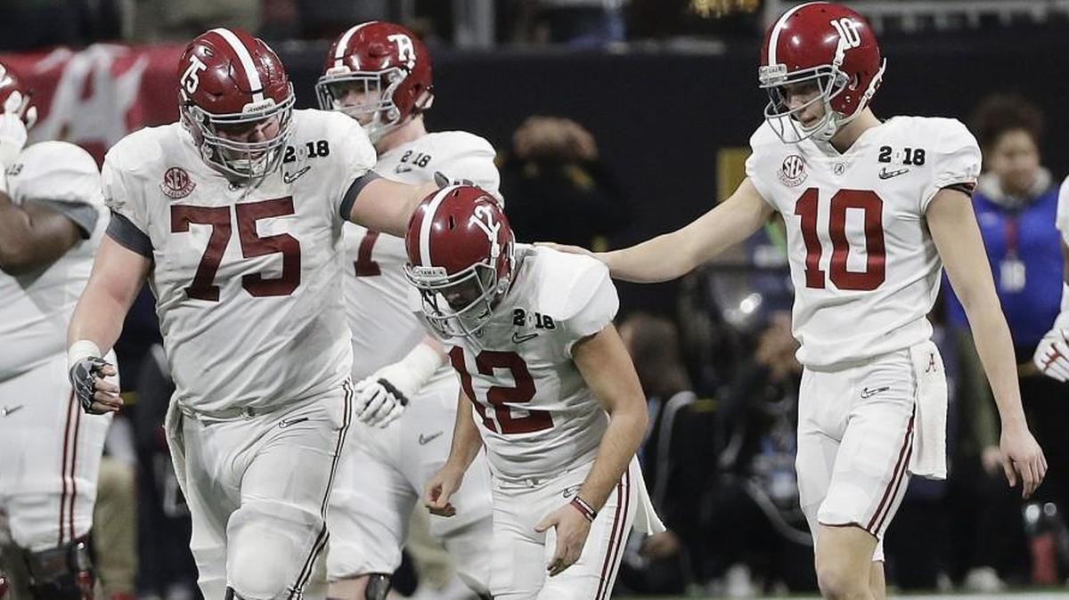 Alabama place kicker Andy Pappanastos was consoled after missing a field goal at the end of regulation.