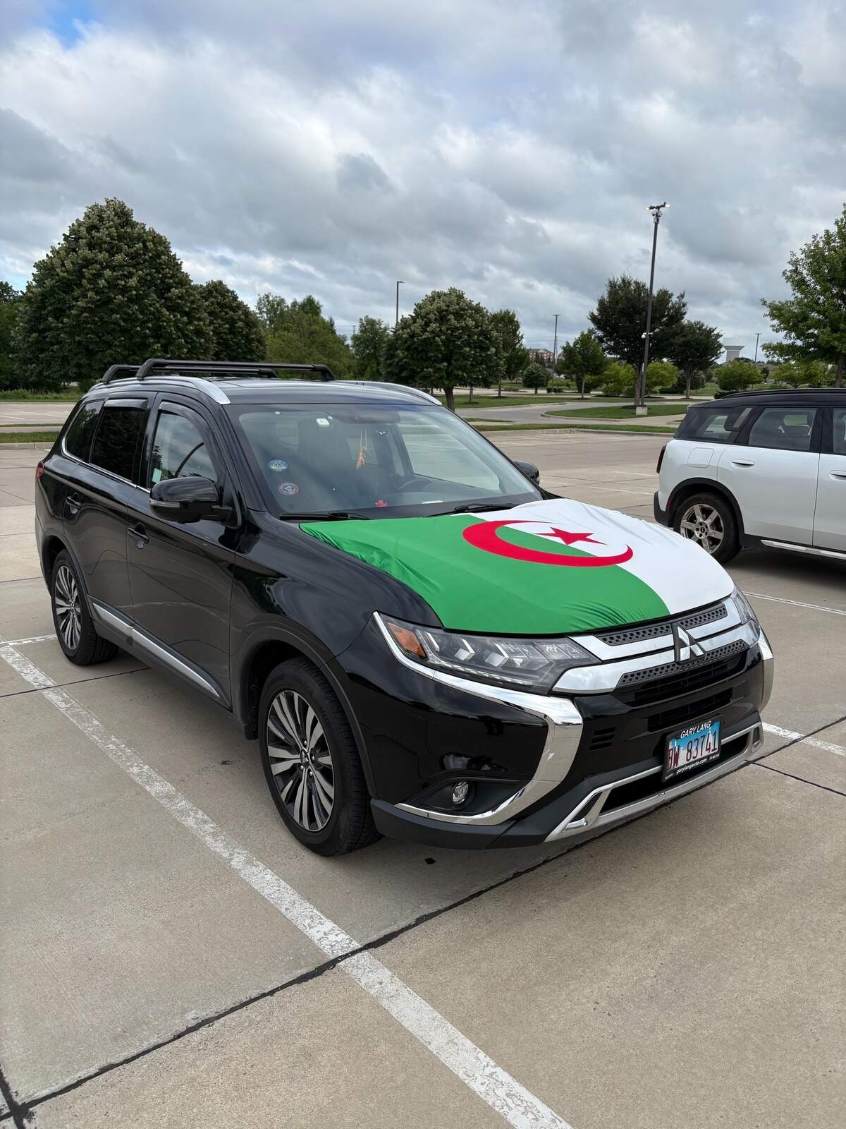 IMG_5124.jpeg Algeria flags were seen all over Lawrence, included on a car outside Rock Chalk Park during a team practice.