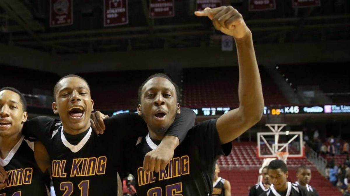 Rasool Samir, front right, celebrates with teammates in his hometown of Philadelphia after helping lead his team to a high school championship in 2014.