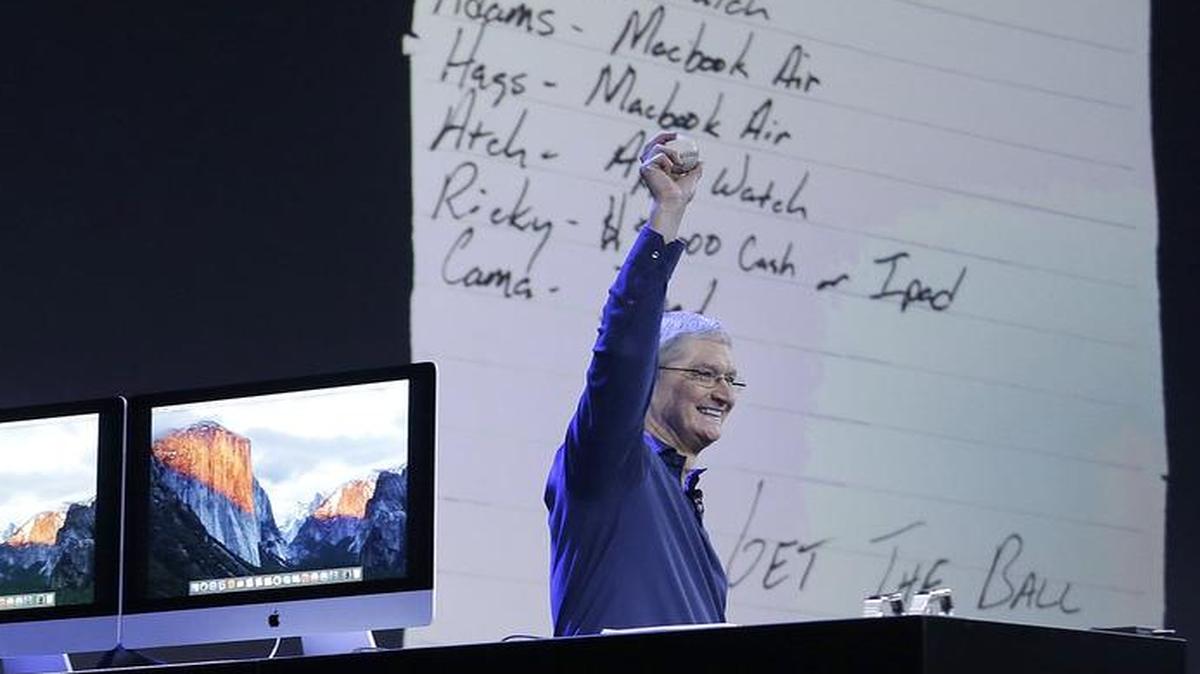 
Apple CEO Tim Cook held up the 100th career home run ball hit by Cleveland Indians' Brandon Moss, in front of a "ransom note" of Apple products that will be given to Moss’ teammates in exchange for the ball, at the Apple Worldwide Developers Conference event in San Francisco on Monday. 
