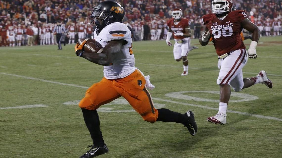 Oklahoma State wide receiver Tyreek Hill (left) during a game in 2014.