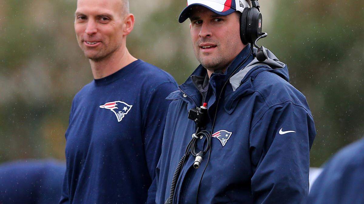 Offensive Coordinator Josh McDaniels and wide receivers coach Chad O'Shea look on during the New England Patriots Super Bowl XLIX practice on Jan. 30, 2015 at the Arizona Cardinals practice facility in Tempe, Arizona.