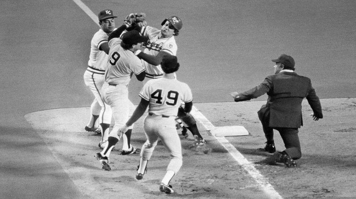 
George Brett came up swinging at his Yankees counterpart, Graig Nettles, after belting a triple in the AL Championship Series in 1977. 
