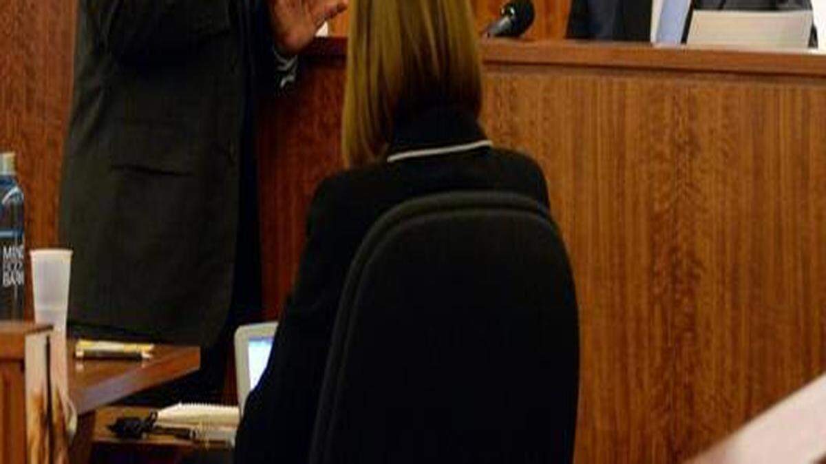 
Defense attorney James Sultan (center) showed Massachusetts State Police Sgt. Timothy Dowd (right) a photo of Odin Lloyd’s body as Judge Susan Garsh (left) listened during the murder trial of former New England Patriots football player Aaron Hernandez on Thursday.
