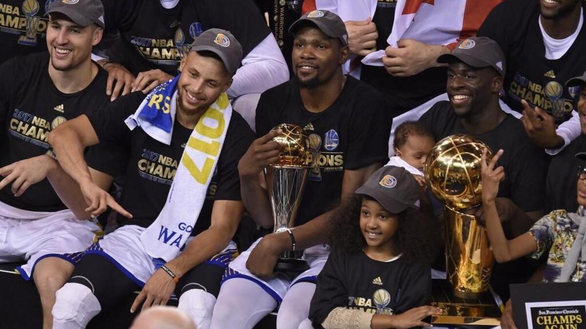 The Golden State Warriors celebrated after defeating the Cleveland Cavaliers 129-120 in Game 5 of the NBA Finals at Oracle Arena in Oakland, Calif., on Monday.