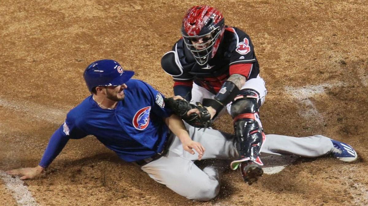 The Chicago Cubs’ Ben Zobrist was safe at home as Cleveland Indians catcher Roberto Perez put on a late tag during the fourth inning of Game 7 of the World Series.