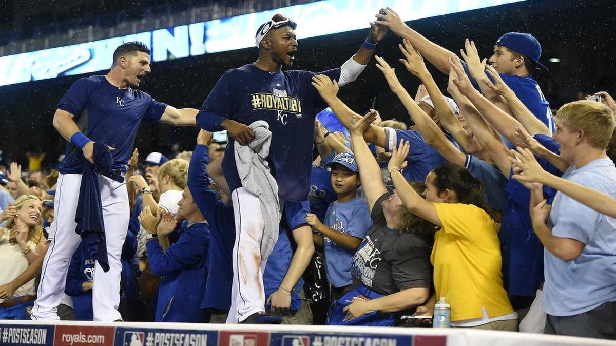 
Kansas City Royals players Johnny Giavotella and Jarrod Dyson celebrated their 9-8 walkoff victory over the Oakland A’s in the AL Wild Card Game on Sept. 30, 2014.
