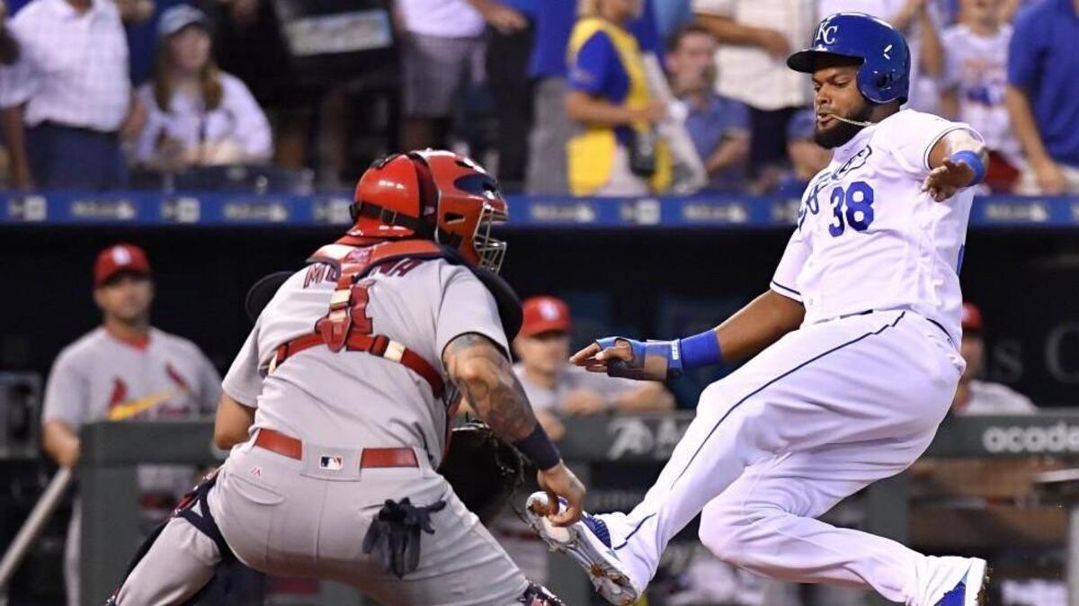 Kansas City Royals outfielder Jorge Bonifacio scored before the throw to St. Louis Cardinals catcher Yadier Molina during a game this season.