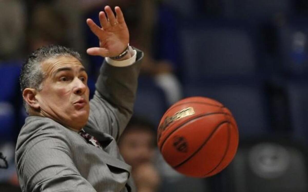 South Carolina head coach Frank Martin dodged a basketball as it sailed out of bounds during a game on March 11.