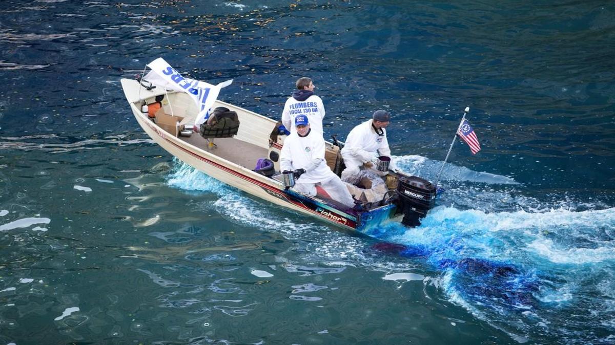The Chicago River is dyed blue near the Michigan Avenue bridge in honor of the Chicago Cubs World Series win Friday.