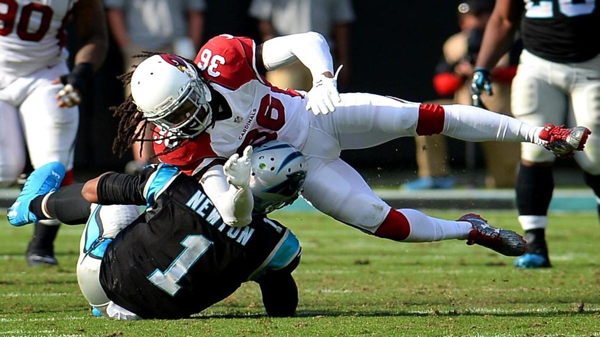 Carolina Panthers quarterback Cam Newton was hit by Arizona Cardinals safety D.J. Swearinger during Sunday’s game.