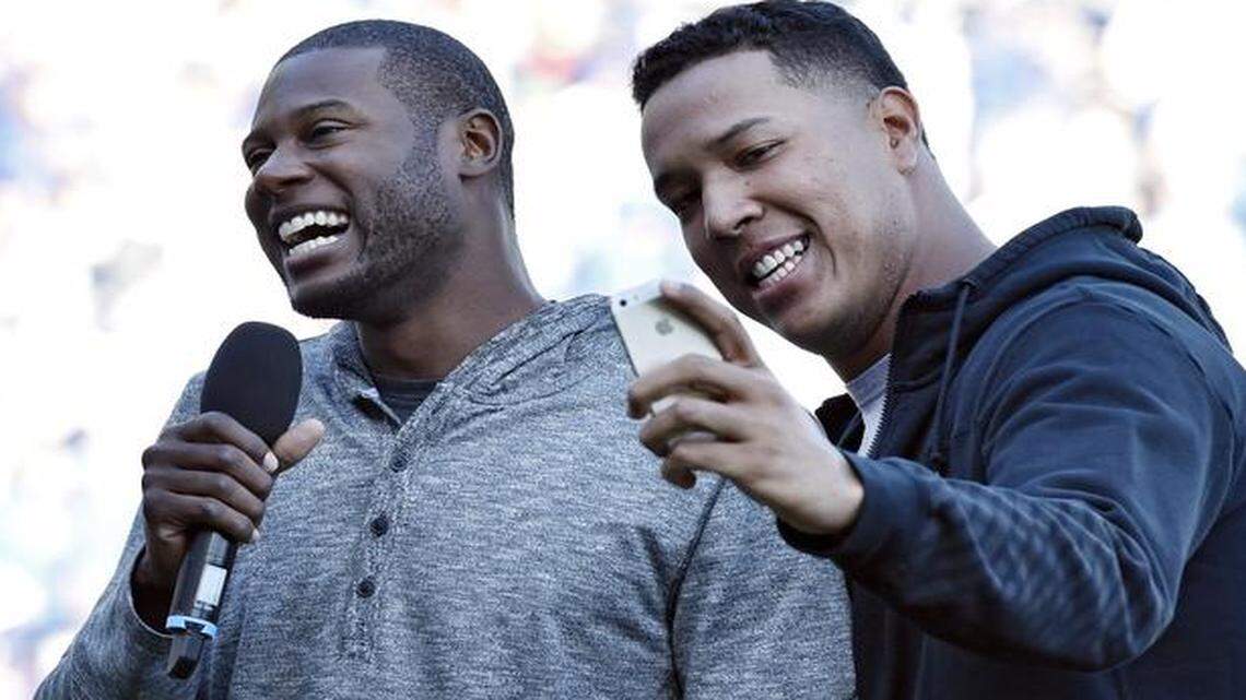 
Salvador Perez took a selfie with his phone as Lorenzo Cain tries to address the crowd during the Royals’ 2014 Season Celebration in October.
