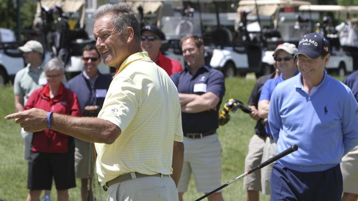 George Brett (left) with Tom Watson (right) hold court during the 10th annual Joe McGuff ALS Golf Classic in 2012.