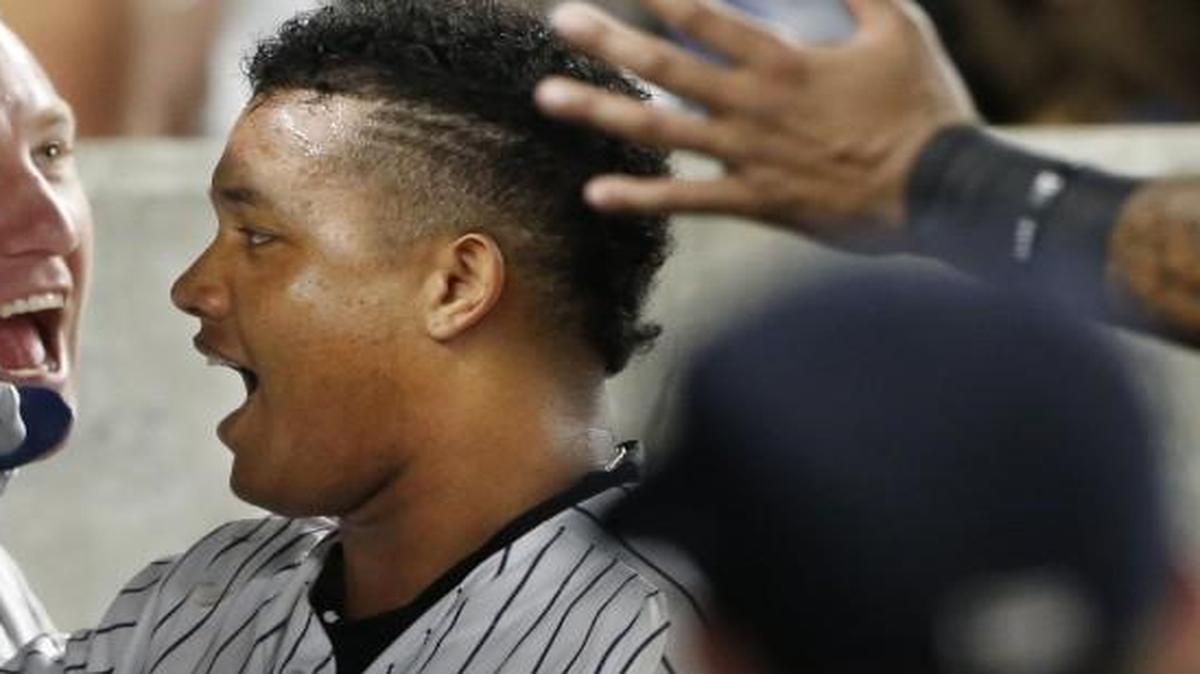 The Yankees’ Starlin Castro celebrated in the dugout after Castro hit a solo home run.