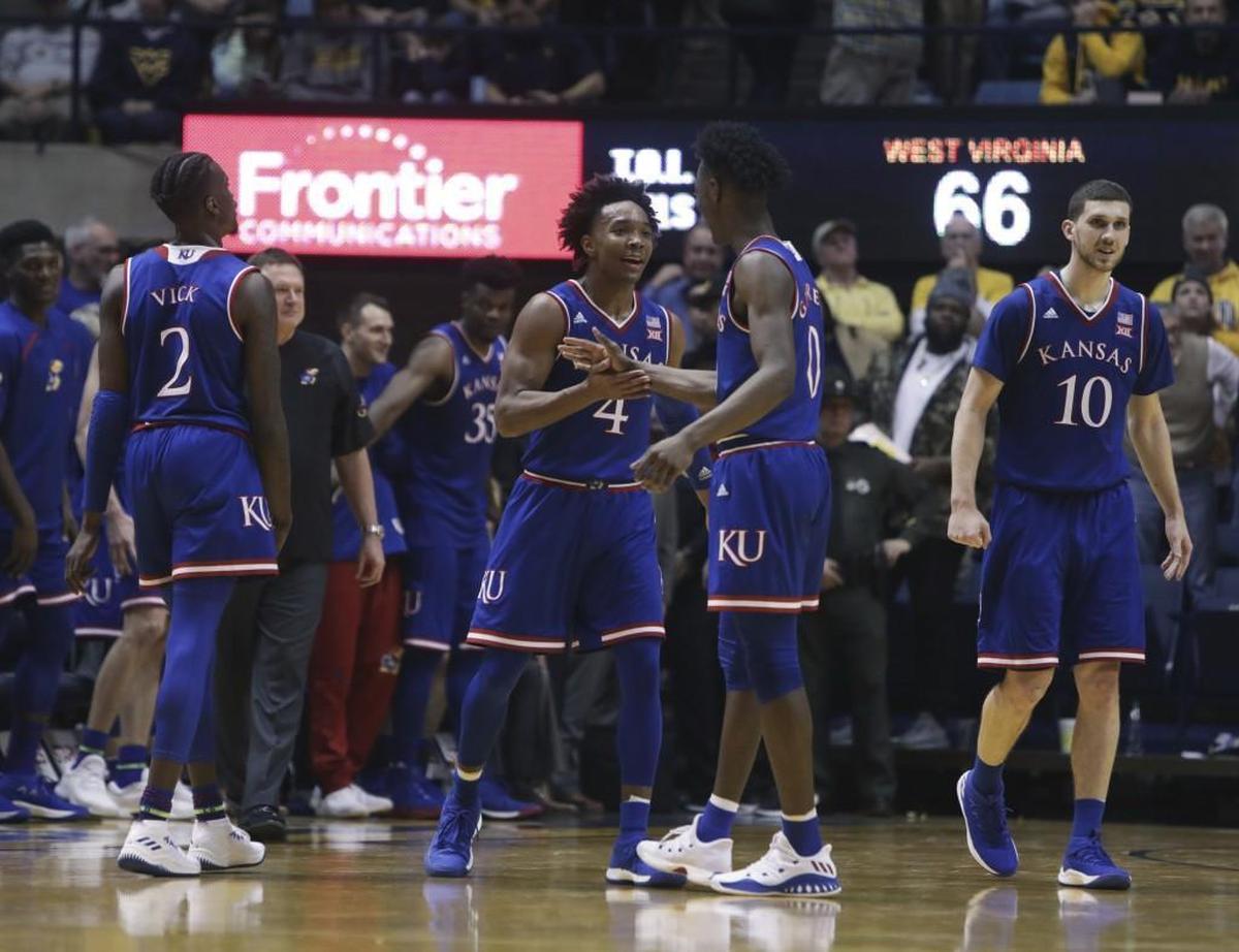Kansas’ Devonte’ Graham and Marcus Garrett celebrated on Monday night.