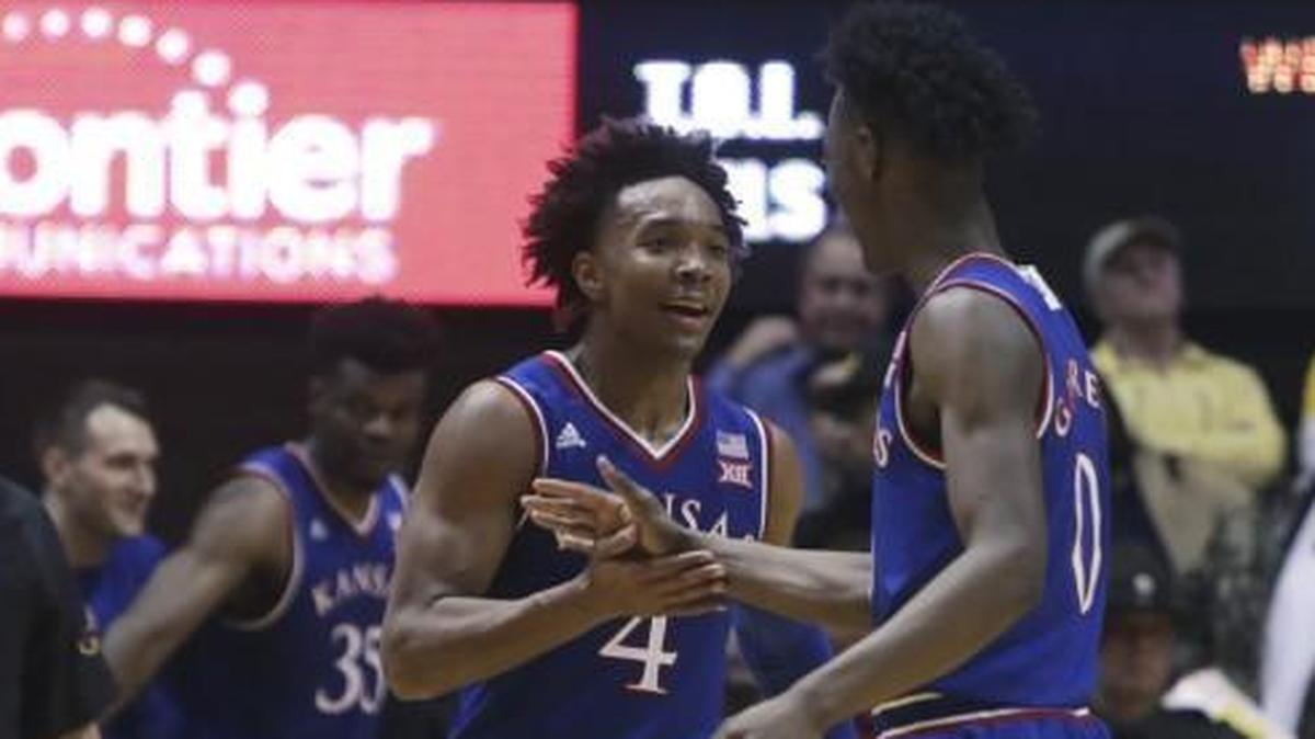 Kansas’ Devonte’ Graham and Marcus Garrett celebrated on Monday night.