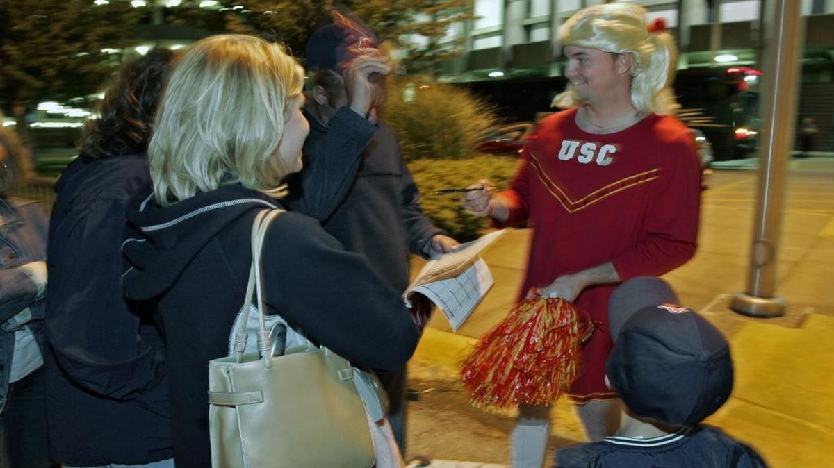 Cleveland Indians rookie pitcher Kyle Denney (right) signed autographs outside Kauffman Stadium before boarding the team bus for the airport following a September 29, 2004 game between the Kansas City Royals and Cleveland Indians.