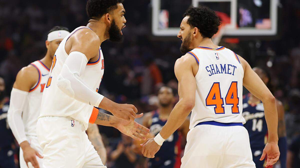 The Knicks’ Landry Shamet #44 and Karl-Anthony Towns #32 celebrate a three-point basket against the Cleveland Cavaliers during the second quarter in Game 4 of the NBA Eastern Conference Finals at Rocket Arena on May 25, 2026 in Cleveland, Ohio.