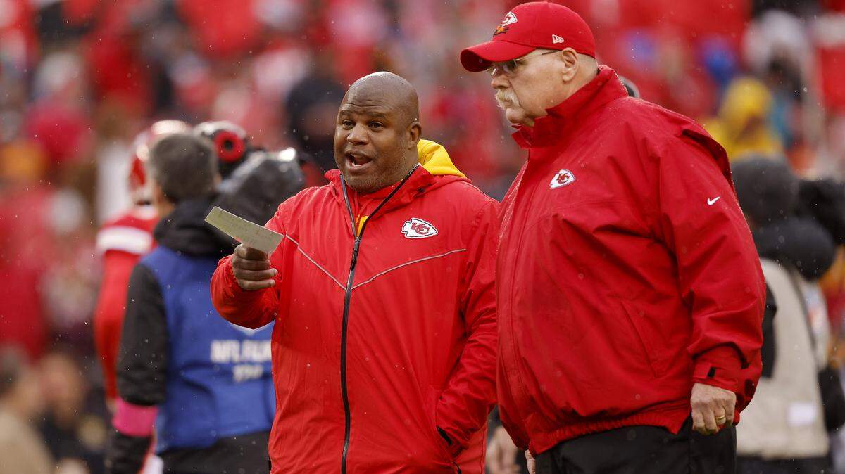 Offensive Coordinator Eric Bieniemy talks with head coach Andy Reid of the Kansas City Chiefs prior to the AFC Divisional Playoff game against the Jacksonville Jaguars at Arrowhead Stadium on Jan. 21, 2023 in Kansas City, Missouri.