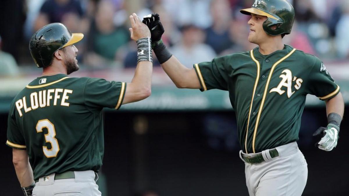 Oakland’s Trevor Plouffe celebrated with Chad Pinder after Pinder hit a home run during a game last year.