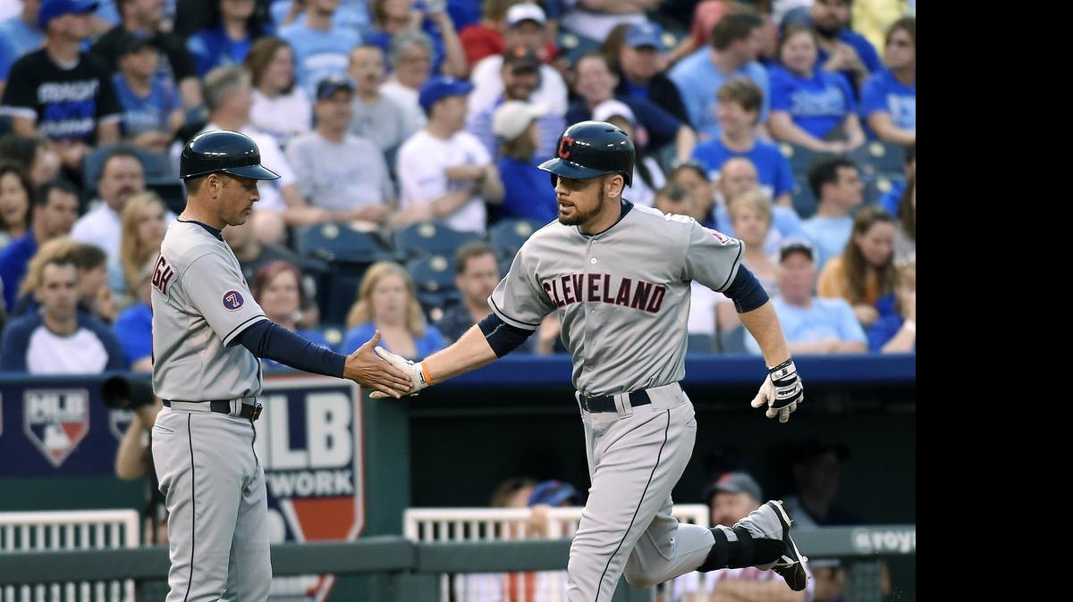 
Cleveland’s Brandon Moss wsa congratulated by third base coach Mike Sarbaugh while rounding the bases on a solo home run in the fourth inning during Tuesday’s game.
