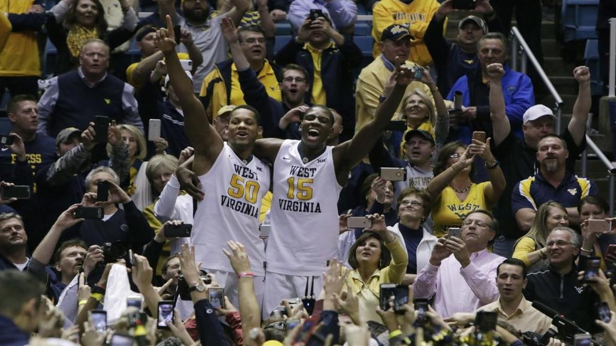 West Virginia’s Sagaba Konate (left) and Lamont West celebrated their win against Baylor on Tuesday in Morgantown, W.Va.