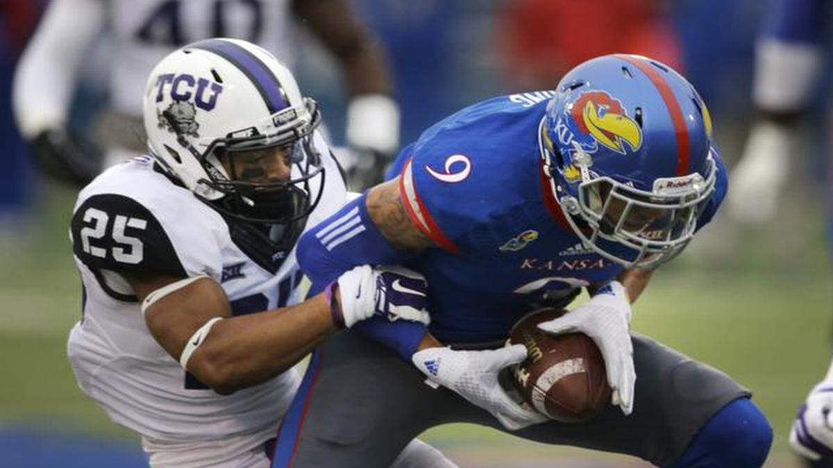 
Kansas wide receiver Nigel King was tackled by TCU cornerback Kevin White during the first half of Saturday’s game. King had a highlight reel catch in the third quarter.
