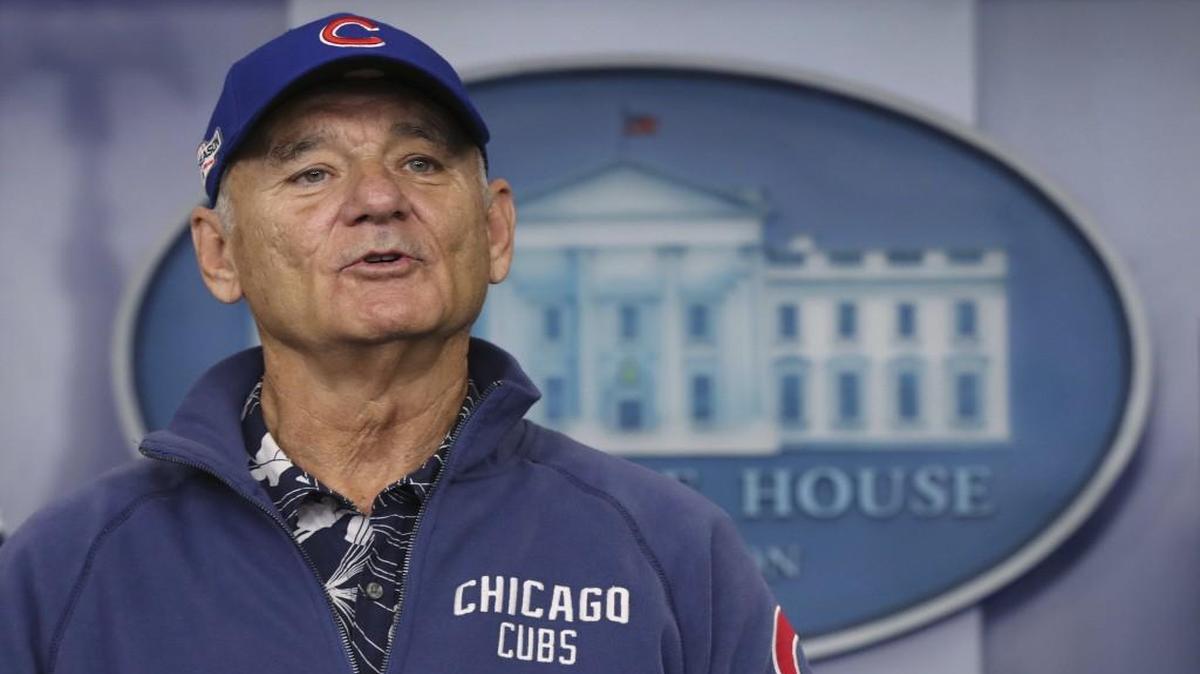 In this Oct. 21, 2016 file photo, actor Bill Murray wore a Chicago Cubs jacket and cap as he talked in the Briefing Room of the White House in Washington.