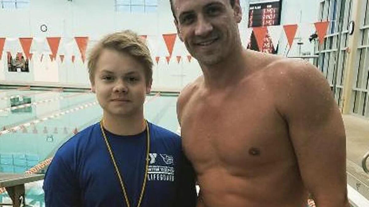 Ryan Lochte posed for a photo with YMCA employee Skylor Parrett.