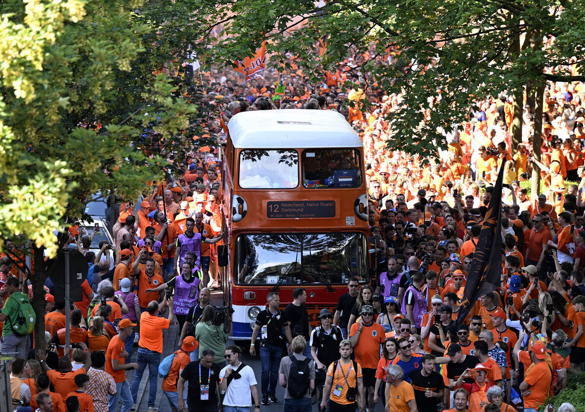 Dutch fans on “The Oranje Walk” cheer in the streets of Dortmund, Germany, on July 10, 2024, prior to the UEFA Euro 2024 Netherlands-England match played in the city later in the day.