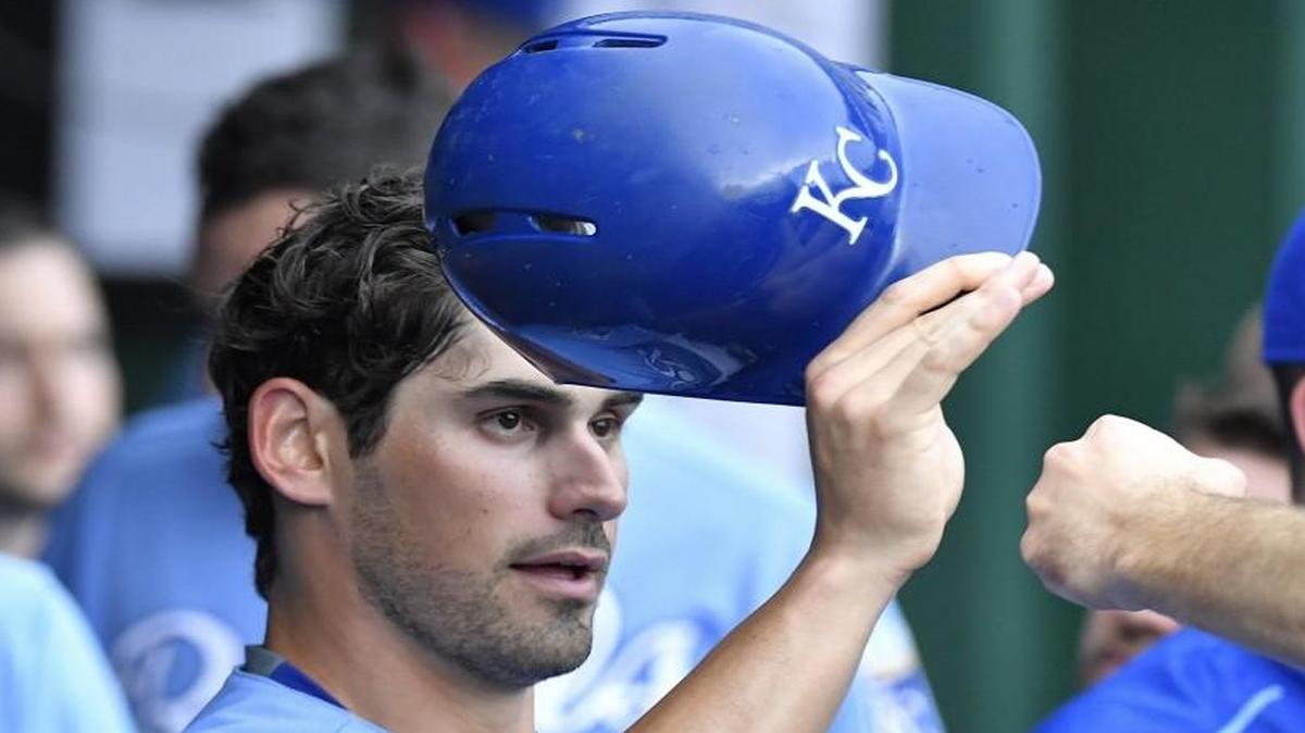 Brett Eibner was greeted in the dugout after scoring on a single by Cheslor Cuthbert in the sixth inning of Saturday’s game against Seattle.