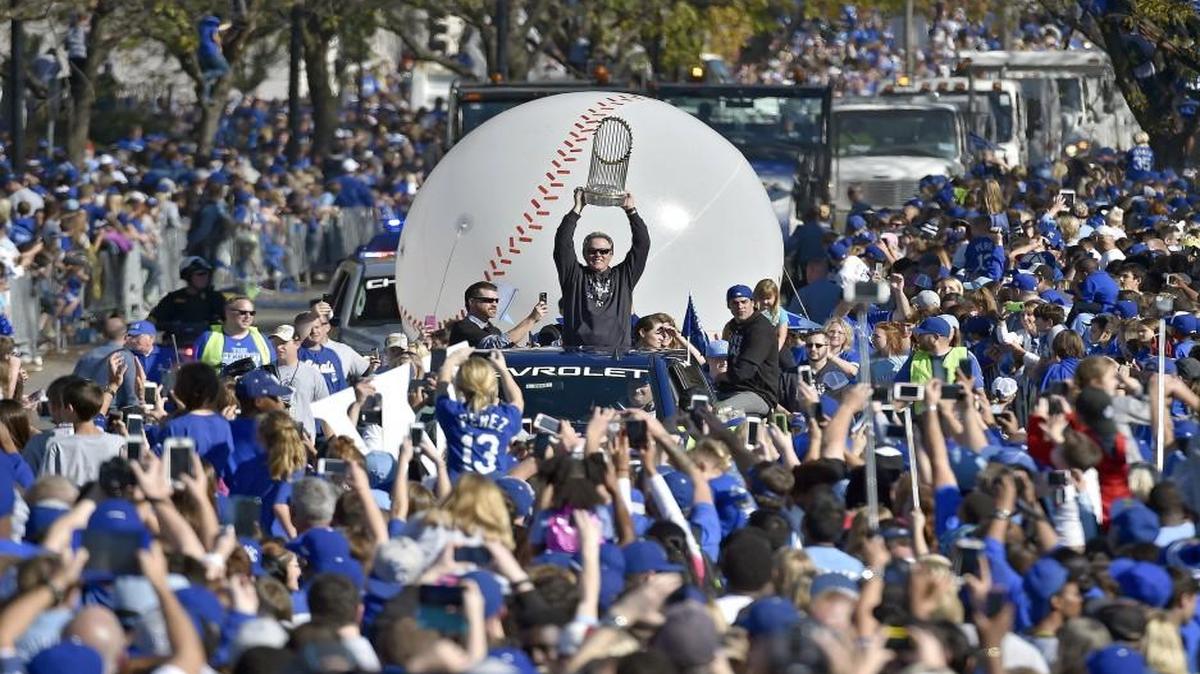 Kansas City Royals manager Ned Yost carried the World Series trophy during last year’s parade and celebration on Nov. 3, 2015.