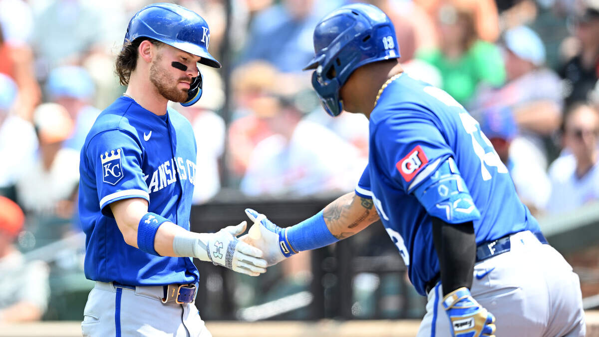 Bobby Witt Jr. #7 of the Kansas City Royals celebrates with Salvador Perez #13 after scoring in the third inning against the Baltimore Orioles at Oriole Park at Camden Yards on Sunday July 12, 2026 in Baltimore, Maryland.