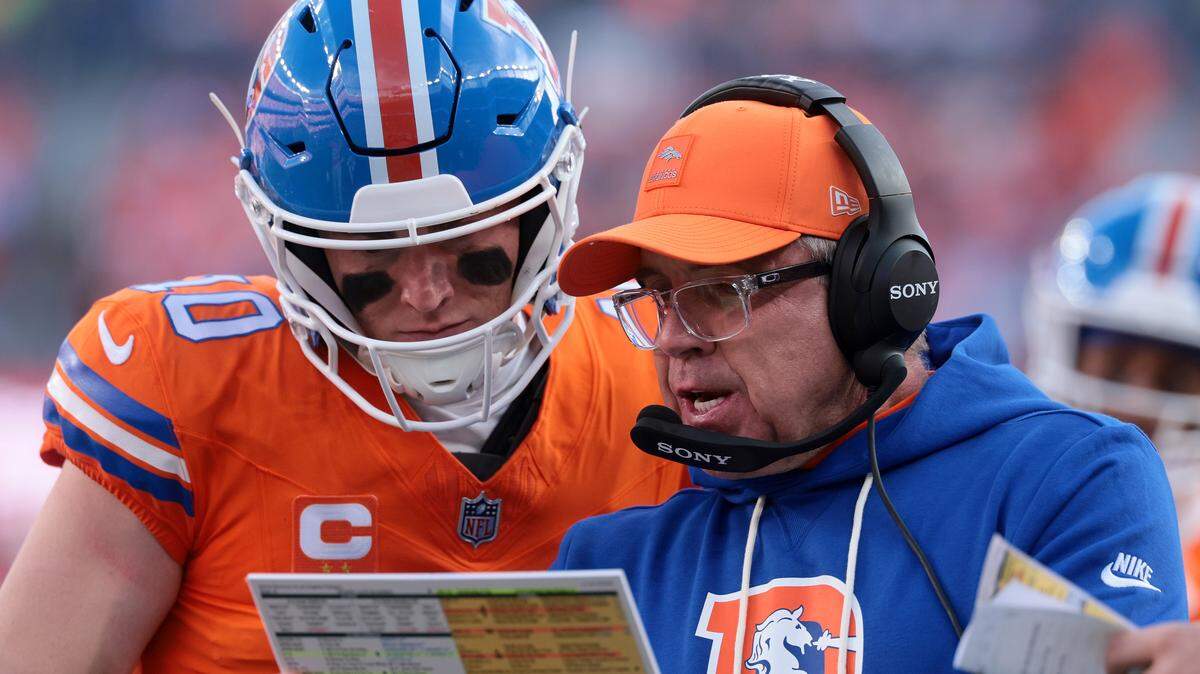 Bo Nix and Denver Broncos coach Sean Payton speak in the second quarter against the Los Angeles Chargers at Empower Field At Mile High on Jan. 4, 2026 in Denver, Colorado.