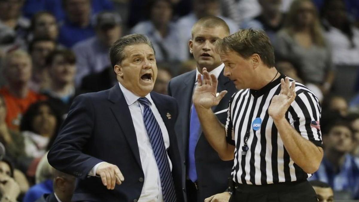 In this March 26, 2017 file photo, Kentucky head coach John Calipari argued a call with referee John Higgins in the first half of the South Regional final game against North Carolina.
