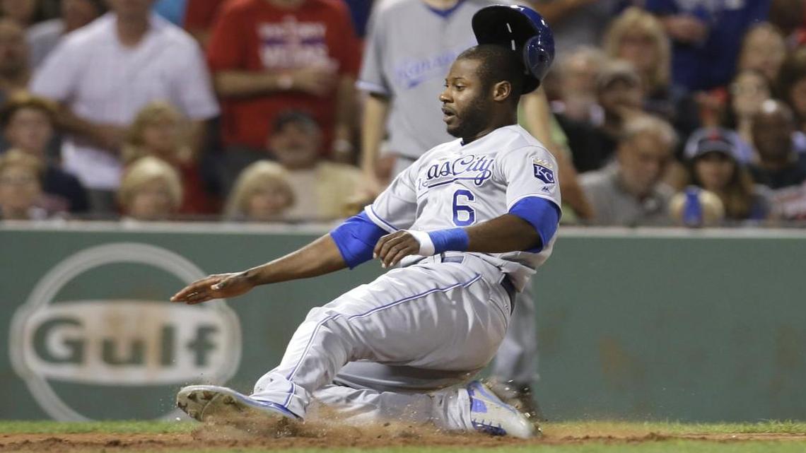 Kansas City Royals outfielder Lorenzo Cain slides safe at home in the sixth inning of a Sunday’s game in Boston. He soon broke out a huge smile.