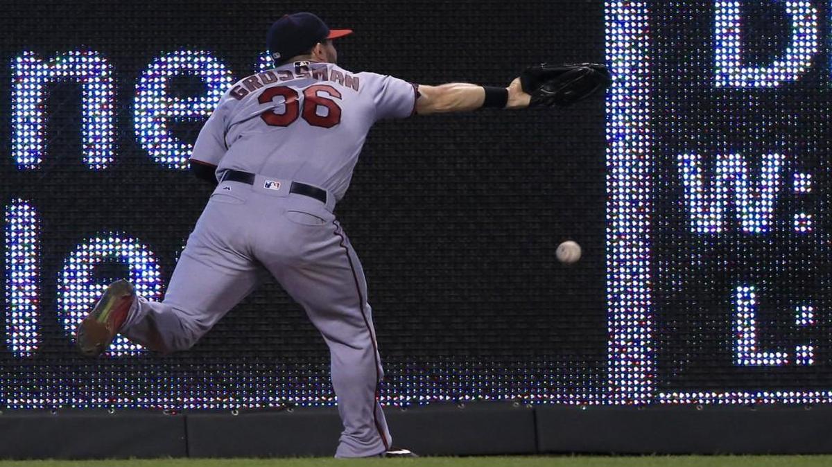 Minnesota Twins left fielder Robbie Grossman was unable to make this catch during Thursday’s game against the KC Royals.