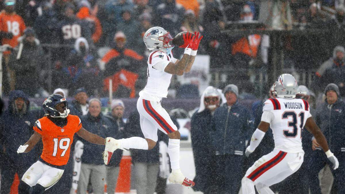 Christian Gonzalez #0 of the New England Patriots intercepts a pass intended for Marvin Mims Jr. #19 during the fourth quarter in the AFC Championship Game at Empower Field At Mile High on Jan. 25, 2026 in Denver, Colorado.